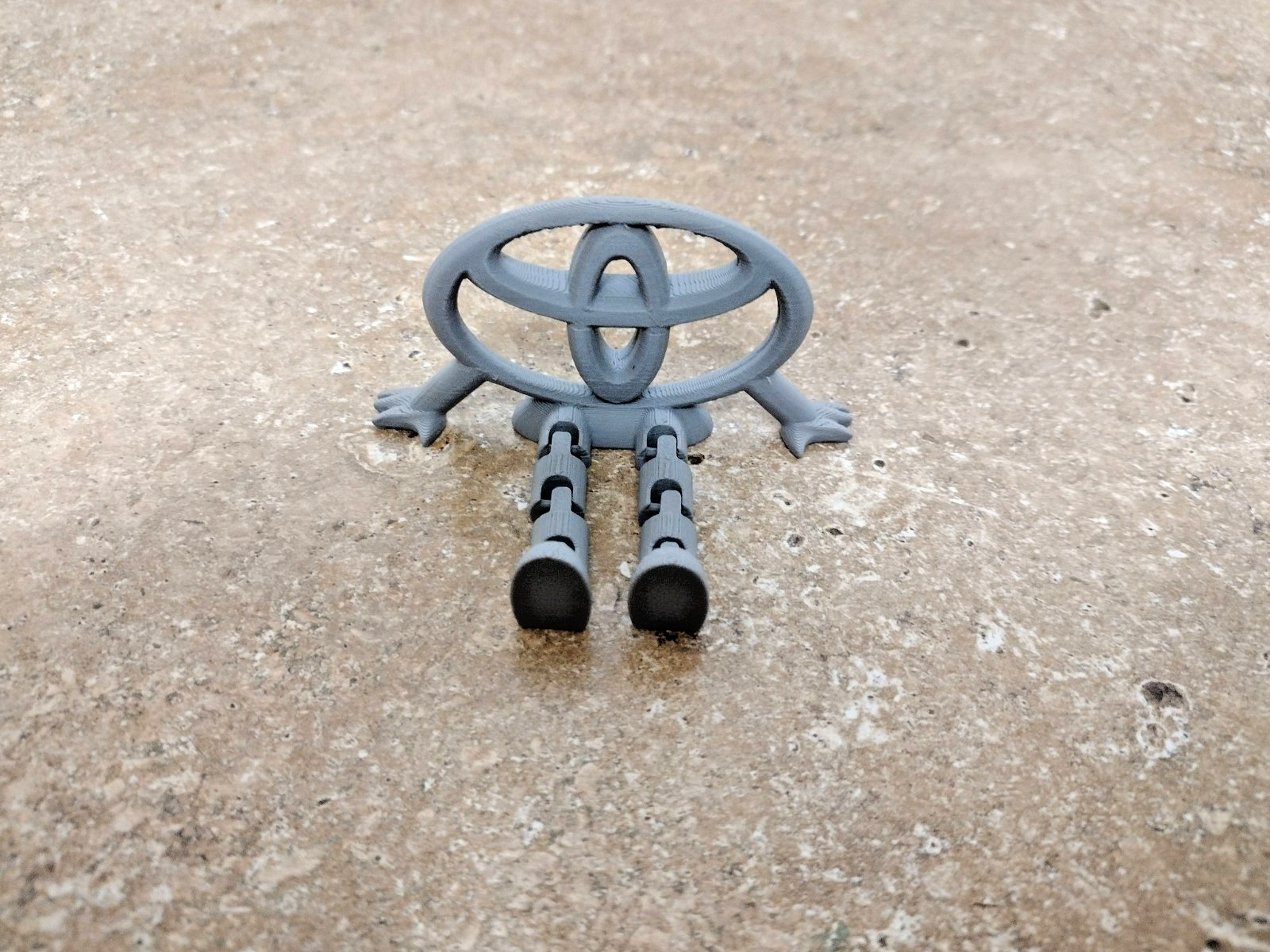 3D Printed Toyota Logo Articulated Desk Toy Figure Gray PLA Decor