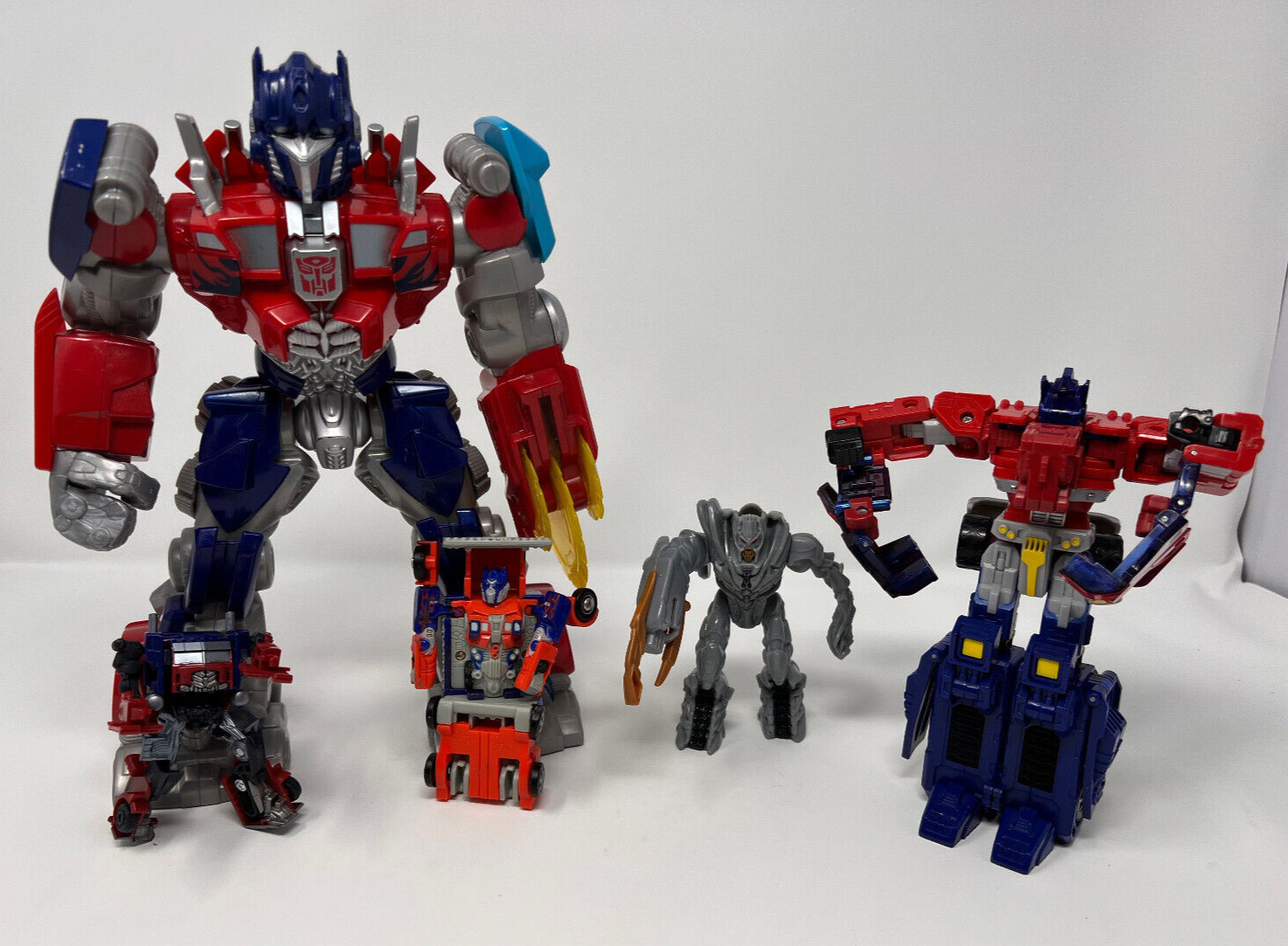 Transformers Action Figure Lot of 5- Assorted Years and Sizes